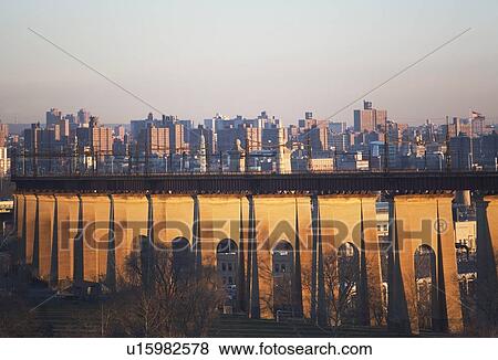 Stock Photo - Bridge with cityscape in background. Fotosearch