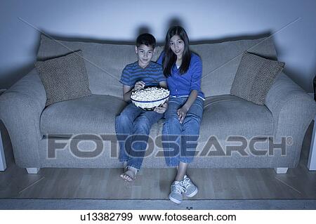Brother and sister (10-11, 12-13) watching television View Large Photo Image Stock Photo - Brother and sister (10-11, 12-13) watching television. Fotosearch
