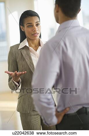 Stock Photo - Business man and woman arguing. Fotosearch