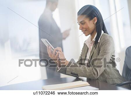 Business woman using tablet pc View Large Photo Image Stock Photograph - Business woman using tablet pc. Fotosearch