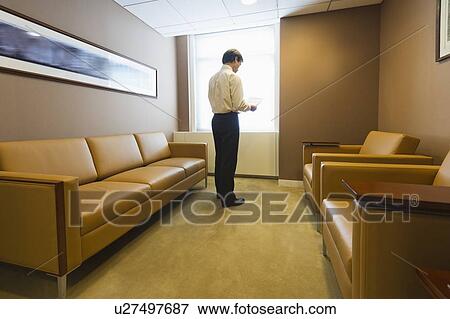 Businessman in office View Large Photo Image Stock Photo - Businessman in office. Fotosearch