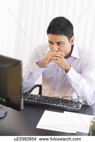 Businessman working on computer View Large Photo Image Picture - Businessman working on computer. Fotosearch