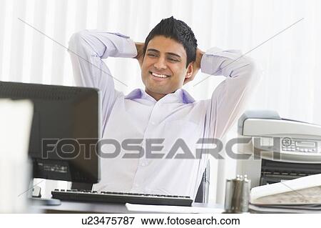 Businessman working on computer View Large Photo Image Stock Photo - Businessman working on computer. Fotosearch