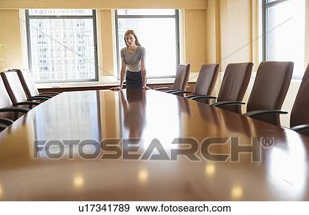 Stock Photo - Businesswoman standing in board room. Fotosearch