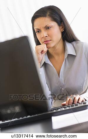 Businesswoman working on computer View Large Photo Image Picture - Businesswoman working on computer. Fotosearch