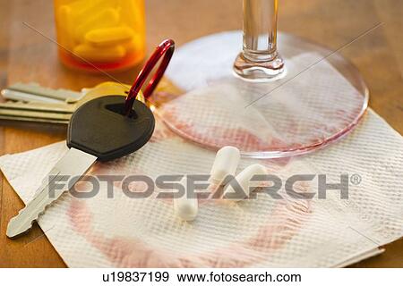 Car keys, pills and alcohol, studio shot View Large Photo Image Stock Photo - Car keys, pills and alcohol, studio shot. Fotosearch