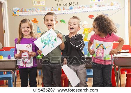 Stock Photo - Children (2-3, 4-5, 6-7) during art classes. Fotosearch