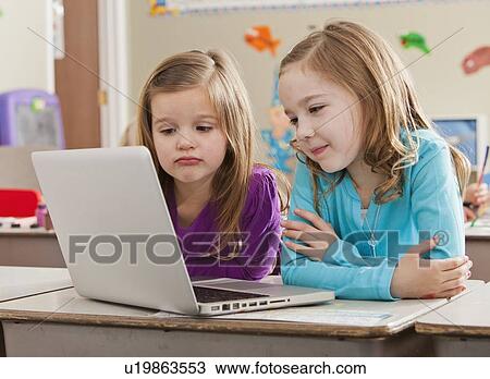 Children (4-5, 6-7) at school using laptop View Large Photo Image Stock Image - Children (4-5, 6-7) at school using laptop. Fotosearch