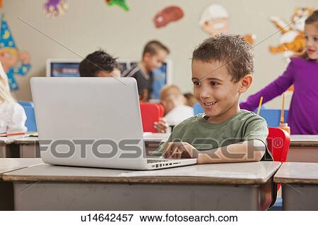 Children (4-5, 6-7) at school using laptop View Large Photo Image Stock Photo - Children (4-5, 6-7) at school using laptop. Fotosearch