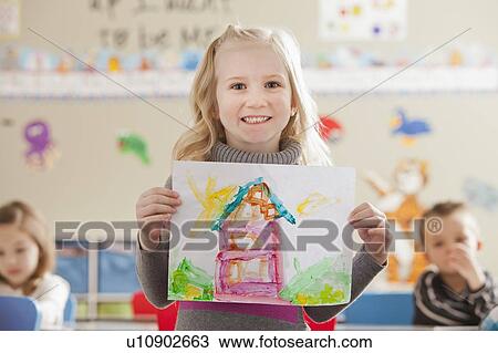 Stock Image - Children (4-5, 6-7) during art classes. Fotosearch