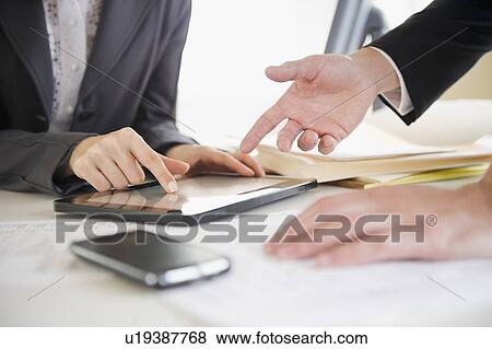 Close up of business people's hand working with digital tablet View Large Photo Image Stock Photo - Close up of business people's hand working with digital tablet. Fotosearch