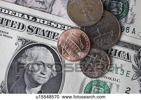 Close-up of dollar banknotes and coins View Large Photo Image Stock Image - Close-up of dollar banknotes and coins. Fotosearch