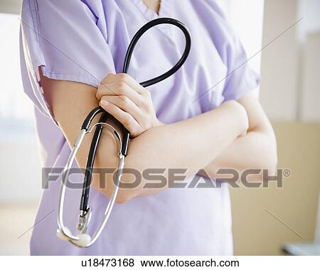 Stock Photo - Close up of female doctor with stethoscope. Fotosearch