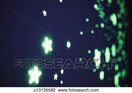 Close up of fluorescent stars on blue background, studio shot View Large Photo Image Stock Image - Close up of fluorescent stars on blue background, studio shot. Fotosearch