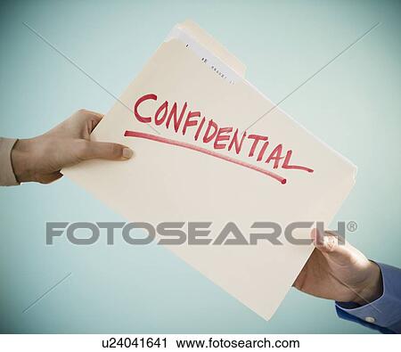 Close up of man's and woman's hands holding confidential document, studio shot View Large Photo Image Stock Image - Close up of man's and woman's hands holding confidential document, studio shot. Fotosearch