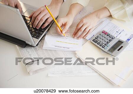 Close up of man's and woman's hands working with laptop View Large Photo Image Stock Photo - Close up of man's and woman's hands working with laptop. Fotosearch