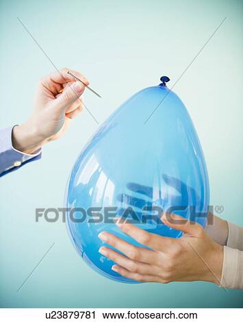 Close up of man's and woman's handholding balloon and nail, studio shot View Large Photo Image Stock Image - Close up of man's and woman's handholding balloon and nail, studio shot. Fotosearch