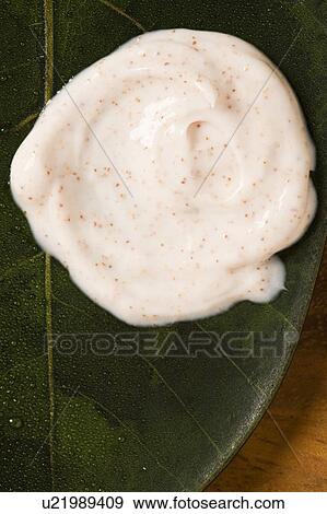 Stock Photo - Close-up of moisturizer on leaf. Fotosearch