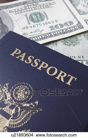 Close-up of passport and dollar banknotes View Large Photo Image Picture - Close-up of passport and dollar banknotes. Fotosearch