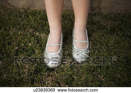 Close-up view of girl's (4-5) legs on grass View Large Photo Image Stock Photo - Close-up view of girl's (4-5) legs on grass. Fotosearch