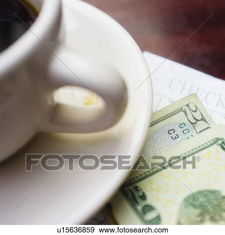 Stock Photo - Coffe and banknote on table. Fotosearch