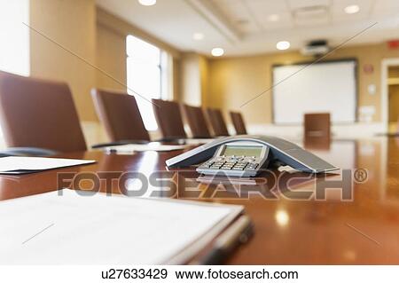 Conference phone on conference table View Large Photo Image Stock Photo - Conference phone on conference table. Fotosearch