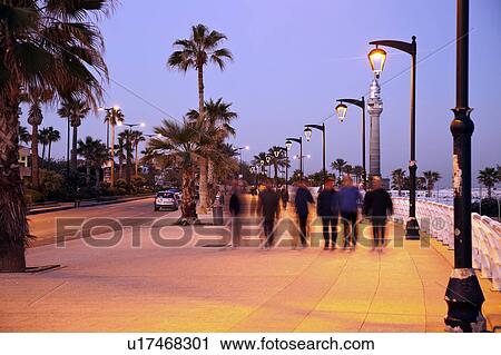 Stock Image - Corniche waterfront at sunrise. Fotosearch