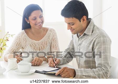 Stock Photo - Couple enjoying tea. Fotosearch
