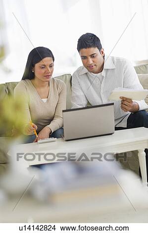 Picture - Couple using laptop. Fotosearch
