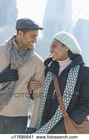 Couple walking in winter clothes View Large Photo Image Stock Image - Couple walking in winter clothes. Fotosearch