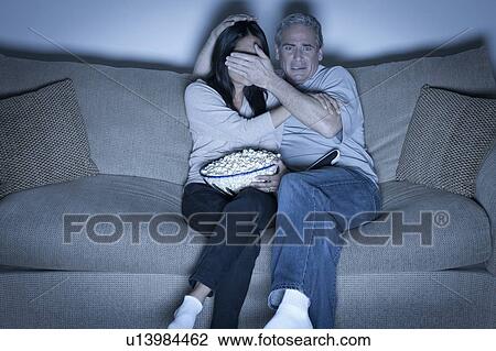 Couple watching television View Large Photo Image Stock Image - Couple watching television. Fotosearch