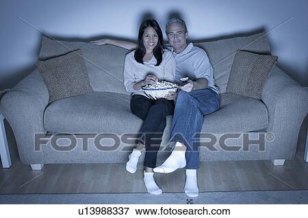 Couple watching television View Large Photo Image Stock Photo - Couple watching television. Fotosearch