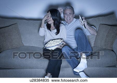 Couple watching television View Large Photo Image Stock Photography - Couple watching television. Fotosearch