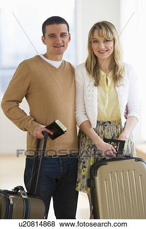 Couple with luggage and passports View Large Photo Image Stock Photo - Couple with luggage and passports. Fotosearch