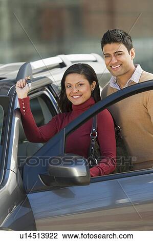 Stock Image - Couple with new car. Fotosearch