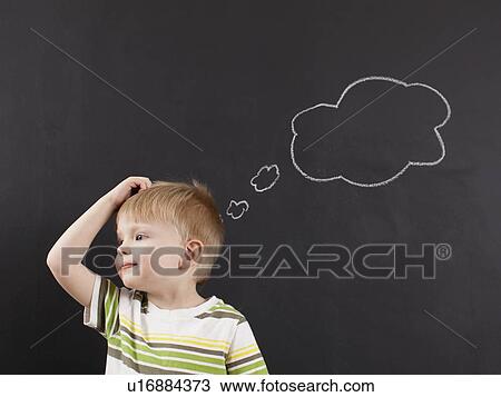 Cute toddler boy (2-3) scratching his head against blackboard with thought bubble written in chalk View Large Photo Image Stock Image - Cute toddler boy (2-3) scratching his head against blackboard with thought bubble written in chalk. Fotosearch