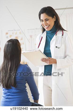 Doctor and patient (12-13) in doctor's office View Large Photo Image Stock Image - Doctor and patient (12-13) in doctor's office. Fotosearch