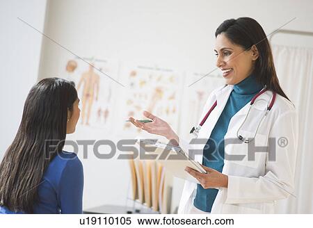Doctor and patient (12-13) in doctor's office View Large Photo Image Stock Photography - Doctor and patient (12-13) in doctor's office. Fotosearch