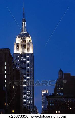 Stock Image - Empire State Building at dusk. Fotosearch