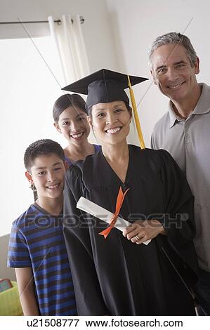 Stock Photo - Family celebrating mother's graduation. Fotosearch