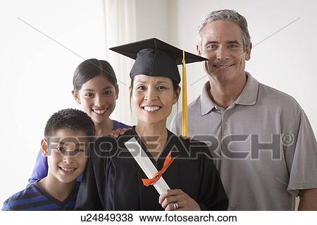 Family celebrating mother's graduation View Large Photo Image Stock Photo - Family celebrating mother's graduation. Fotosearch