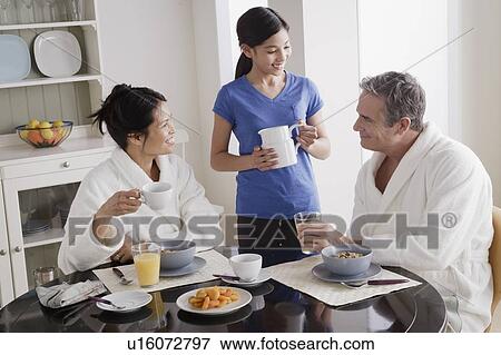 Family having breakfast View Large Photo Image Stock Photo - Family having breakfast. Fotosearch