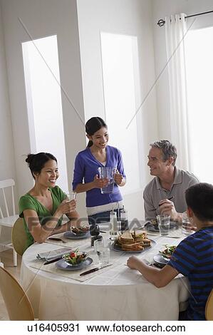 Stock Image - Family having breakfast together. Fotosearch