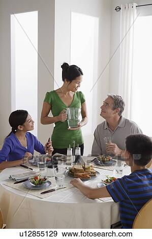 Family having breakfast together View Large Photo Image Stock Photo - Family having breakfast together. Fotosearch