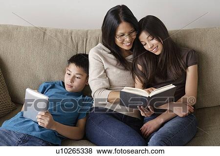 Family reading together View Large Photo Image Stock Photo - Family reading together. Fotosearch
