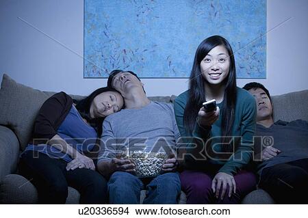 Picture - Family watching TV . Fotosearch