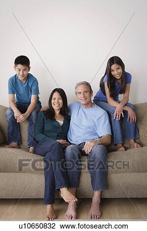 Father with children embracing on sofa View Large Photo Image Stock Image - Father with children embracing on sofa. Fotosearch