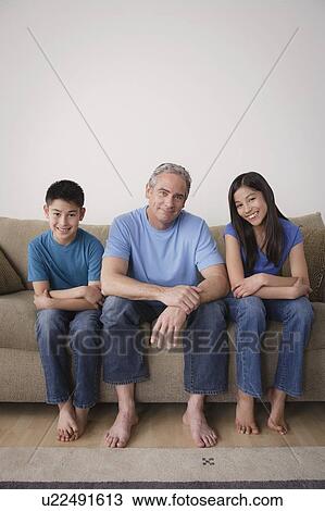 Father with children sitting on sofa View Large Photo Image Stock Image - Father with children sitting on sofa. Fotosearch