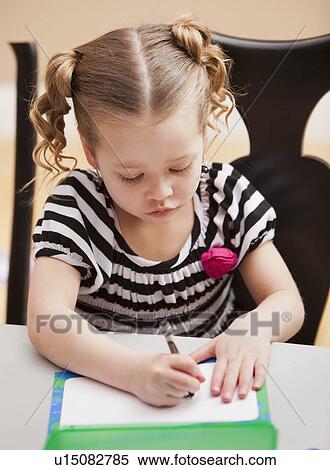 Stock Photography - Front view of girl (4-5) drawing . Fotosearch