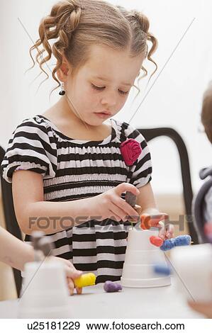 Girl (2-3) playing in kindergarten View Large Photo Image Stock Photo - Girl (2-3) playing in kindergarten. Fotosearch